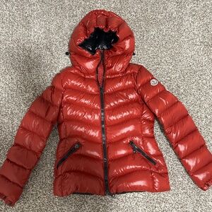 Moncler women’s short puffer down jacket with logo patch